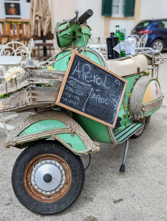 A Vespa and an aperitivo board
